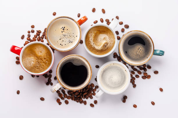 istock A steaming cups of freshly brewed coffee surrounded by rich, aromatic roasted coffee beans 2205695372