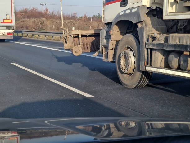 istock a machine for flushing the streets with water from a cistern. dust and mud from the wheels of trucks polluting the highway must be regularly washed away around the construction site 2205695950