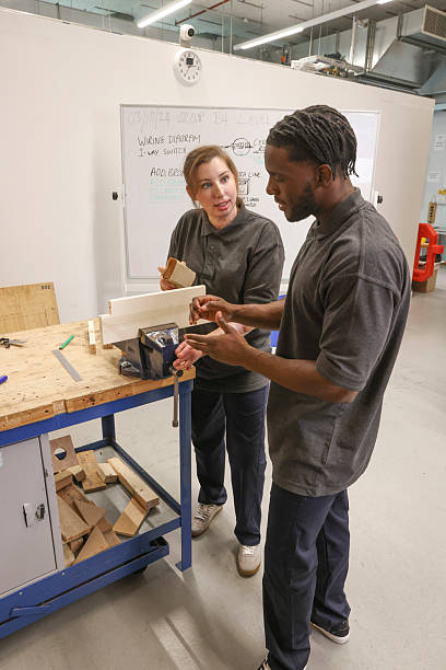 istock Disabled man and woman at workshop 2205696100