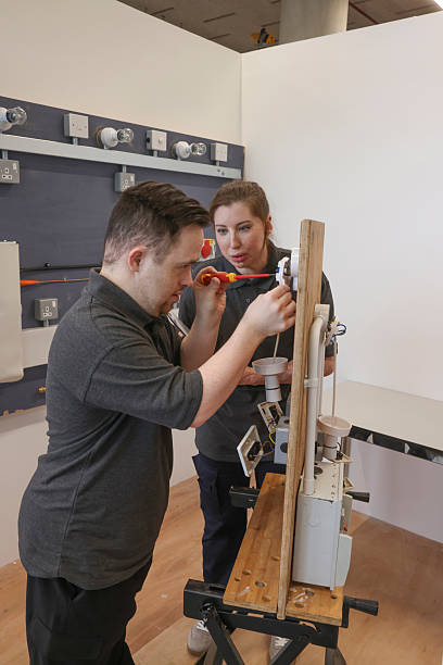istock Disabled men and woman at workshop 2205696771
