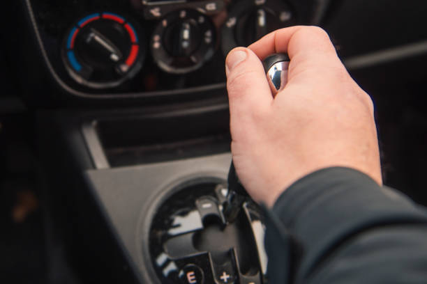 istock A simple type transmission in a car. Close-up - A man changes gear in a car. View from above 2205697398