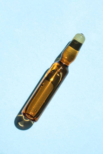 istock Ampoule of cosmetic gel on a blue background. 2205697672