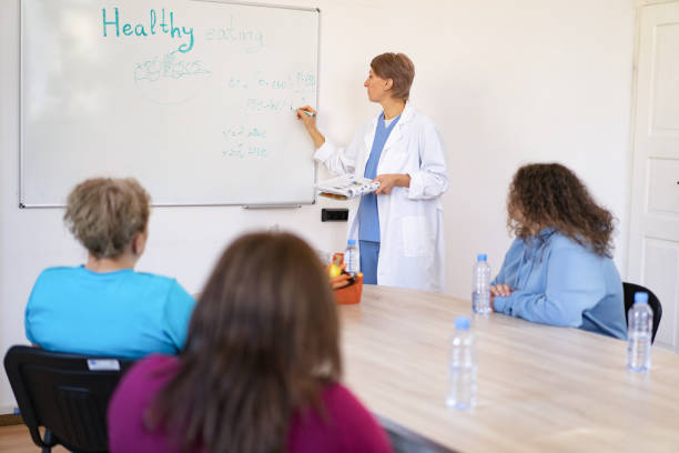 istock Interactive health lecture with attentive listeners 2205703812