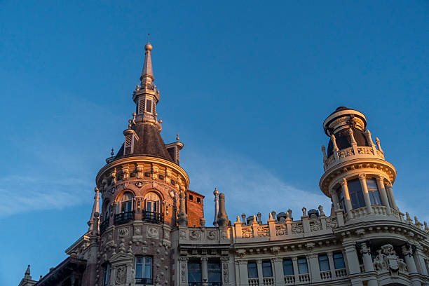 istock An impressive building with a tower against a bright blue sky 2205705327