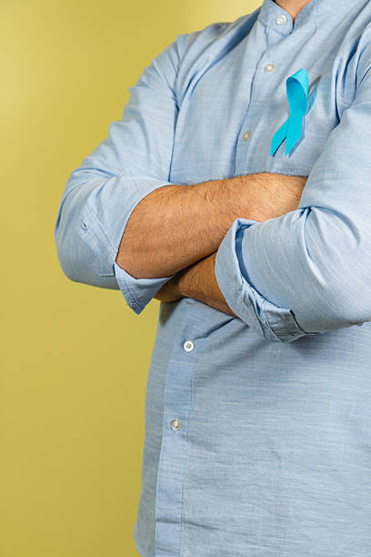 istock Support for prostate cancer awareness with blue ribbon on shirt 2205705948