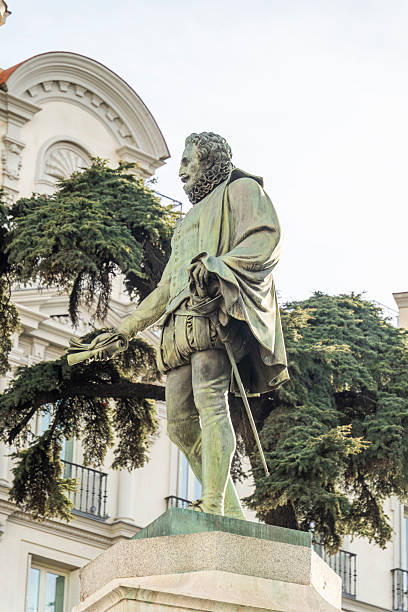 istock A statue of a man beside a tree in front of a building 2205707653