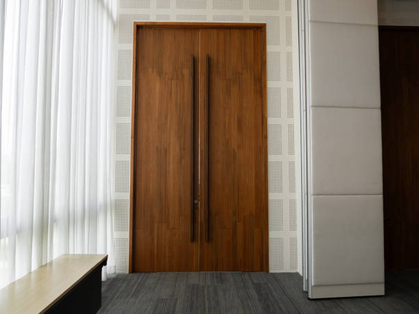 istock Modern wooden door concepts for architectural minimalist office spaces 2205711732