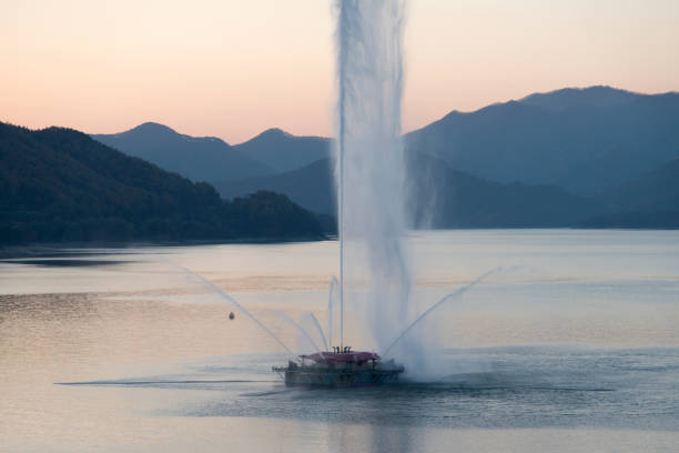 istock View of the fountain and sprayed water during sunset 2205712444