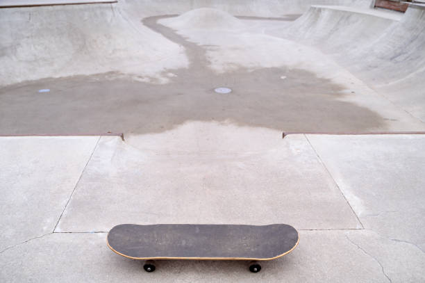 A skateboard or a longboard on a pump trek or a pump ramp, copy space. High quality photo