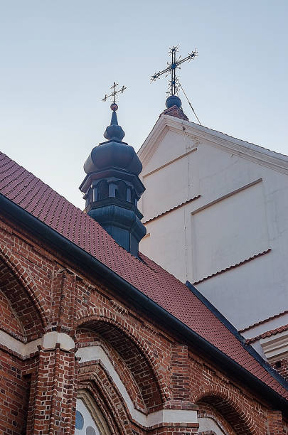 istock Architectural Details: Brick and White Building with Crosses, Rooftop View, Historic, Religious Symbolism 2205713886