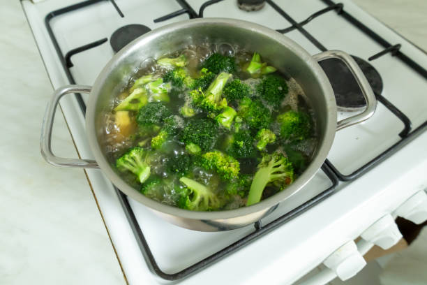 istock Chopped broccoli is cooking on the gas stove. 2205714127