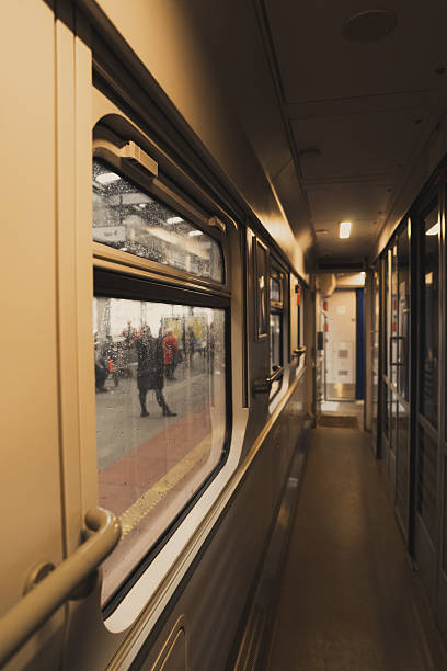 istock Traveling by intercity train in a compartment car, train interior, train station. 2205714887