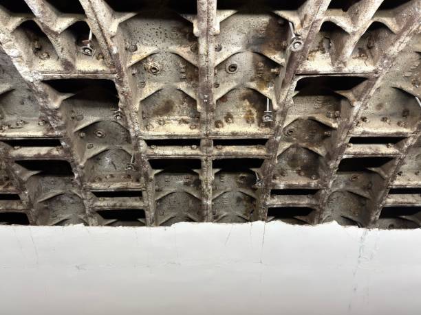 istock Metal inserts in the ceiling of a building on a construction site with a white wall 2205716349