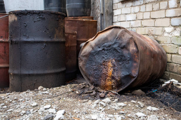 istock Rusted Barrels and Leaking Substance in Industrial Waste Area 2205716352