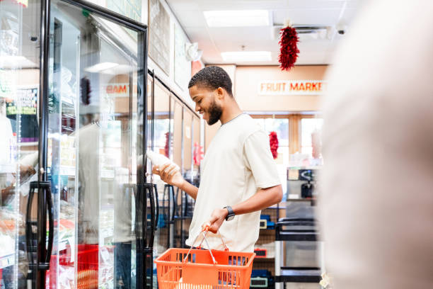 istock Man Selecting Milk in a Grocery Store, Casual Shopping 2205717809