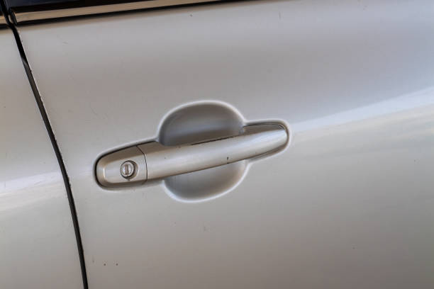 istock Car door handle close-up urban setting detail shot modern environment informative viewpoint 2205718186