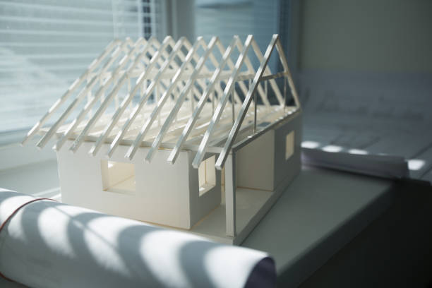 istock Paper model of a house 2205720495