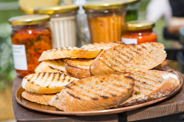 Slices of bread toasted on an outdoor grill