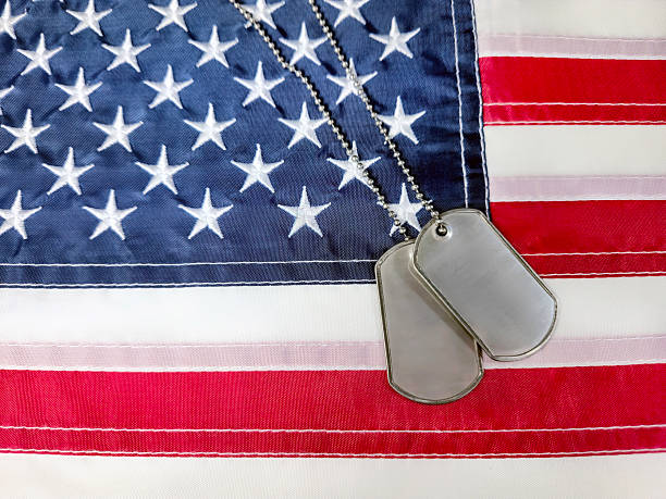 istock Military Dog Tags On an American Flag 2205721677