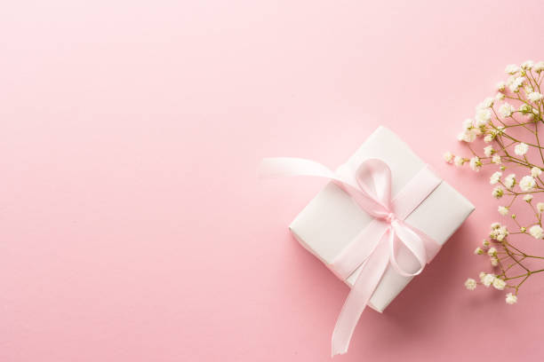 istock Gift box with flowers on pink. 2205723245