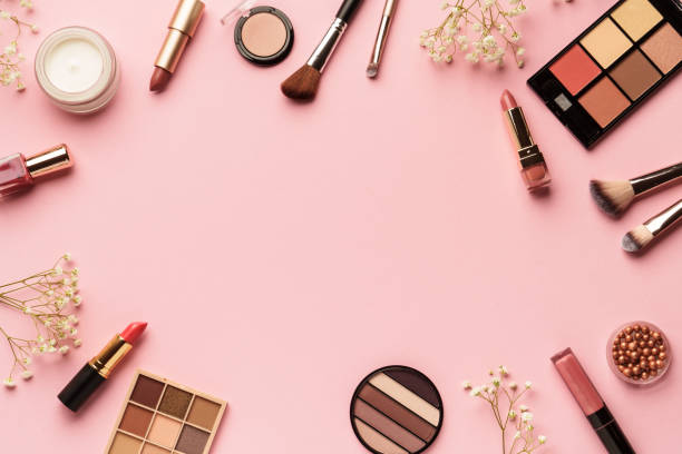 istock Makeup products flat lay background on pink. 2205723406
