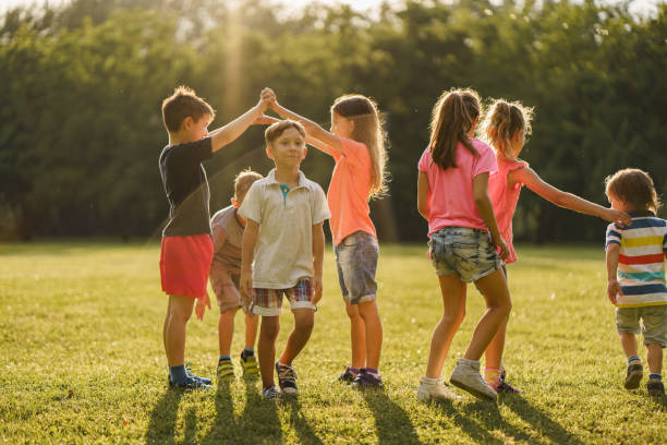 istock Children playing in public park 2205724787