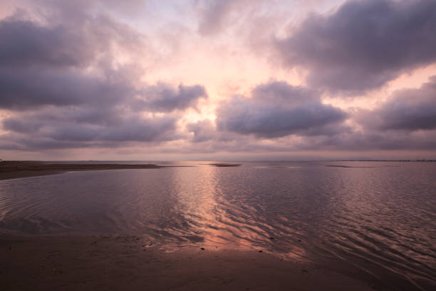 istock Pink lights over the sea at sunset 2205724907
