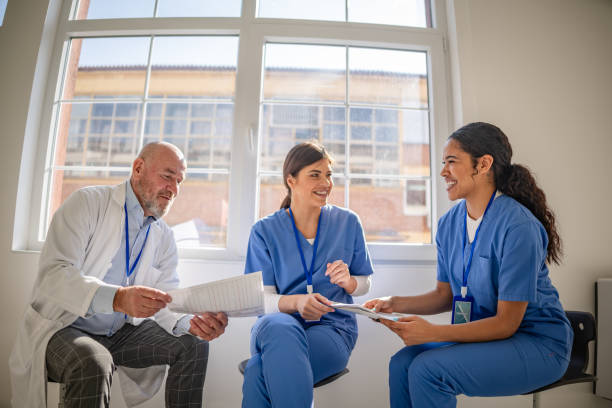istock Healthcare workers engage in collaborative planning in a modern hospital setting with a focus on teamwork and patient care 2205728259