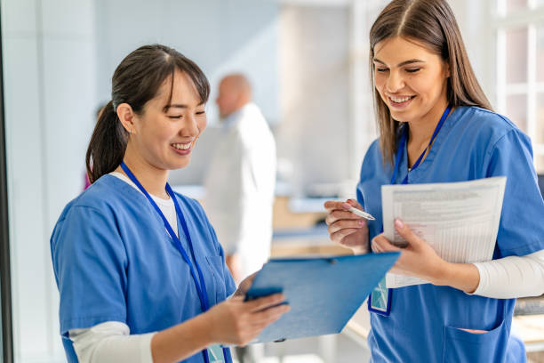 istock Healthcare workers engage in teamwork and discussion in a modern hospital setting 2205729767