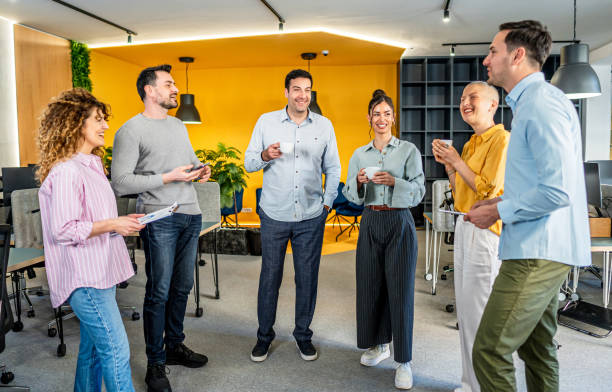 istock Colleagues having a coffee break in a workplace 2205730747