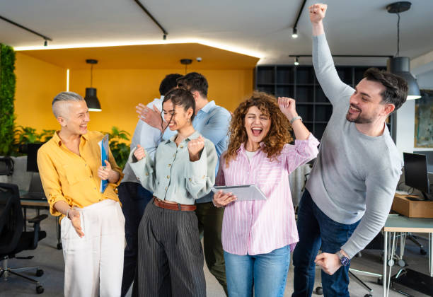 istock Office workers celebrating financial success 2205731677