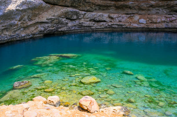 istock Deep cave with lake at Sinkhole Park in Oman 2205733262
