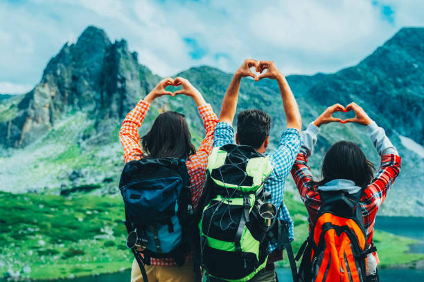 istock Friends celebrating nature with heart gestures 2205735184