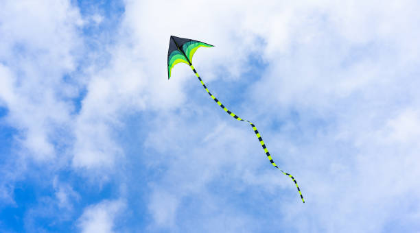 istock Colorful kite flying on sky background 2205735434