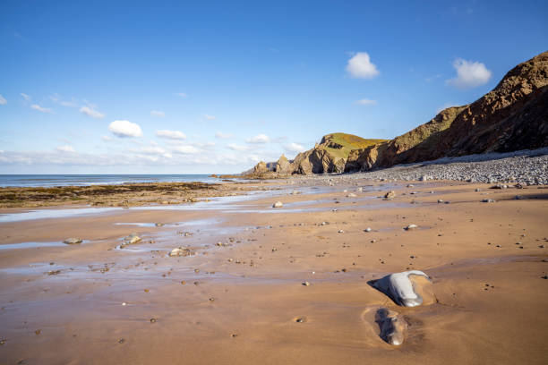 Bright spring sunshine on Sandymouth Bay at half tide
