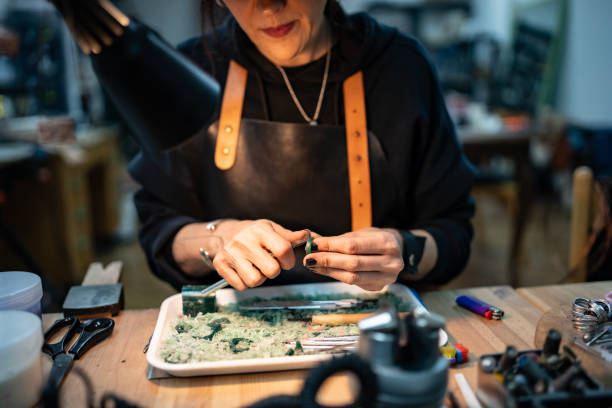 istock Artisan Focusing on Intricate Craft Work in a Cozy Workshop Setting 2205737186