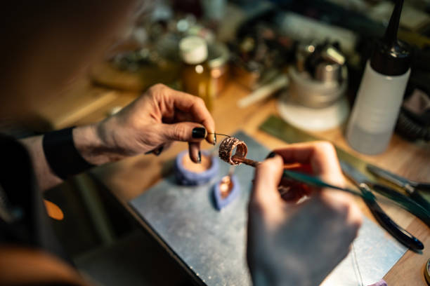 istock Artisan Crafting Jewelry Using Fine Tools and Materials in a Workshop 2205737272
