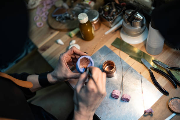 istock Hands Crafting a Small Artisan Wire and Resin Object in a Workshop 2205737298