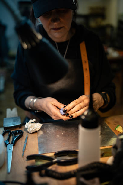 istock Close-Up of Artisan at Work Crafting Detailed Handmade Objects in Workshop 2205737422