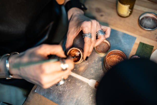istock Hands Mixing Metallic Pigments for Artistic Crafting Project on a Desk 2205737728