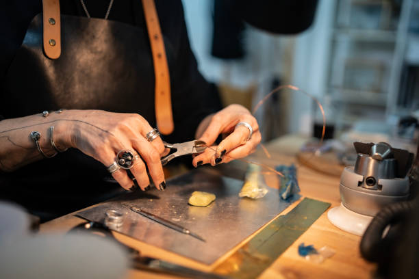 istock Jewelry Maker Crafting Artisan Items in Workshop with Precision and Creativity 2205737757