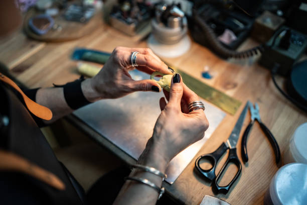 istock Artisan Crafting Jewelry at a Workbench with Tools and Materials 2205737761