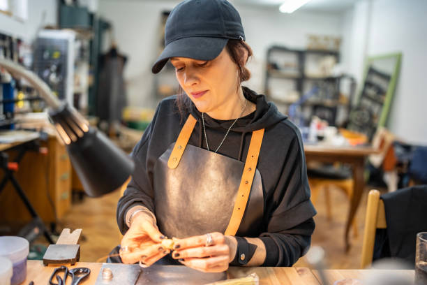 istock Craftswoman Focused on Making Jewelry in a Workshop Setting 2205737762