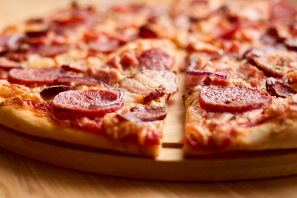 istock Freshly baked pepperoni pizza features a crispy crust, melted cheese, and savory toppings. Perfect for sharing during a casual meal with friends or family 2205742458