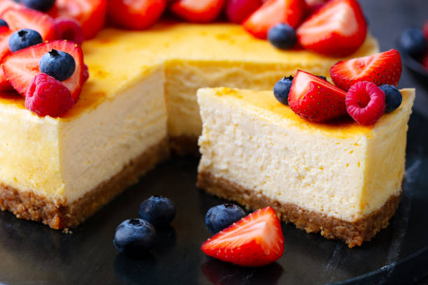 istock Cheesecake dessert with fresh berries. Dark background. Close up. 2205751143