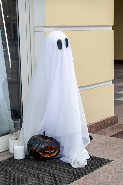 istock Creative ghost decoration near a storefront during Halloween 2205753198