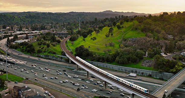 istock Subway Train Passing over Interstate 680 in Walnut Creek, California - Aerial View 2205755899
