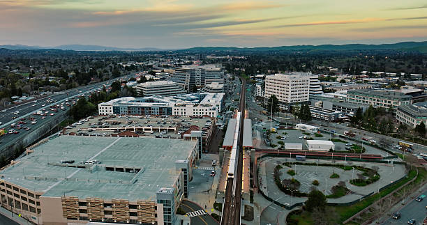 istock Aerial View of a Subway Train at BART Station at Sunset 2205756058