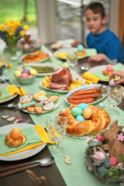 istock Easter Lunch with Roast Pork, Vegetables, Easter Cookies and Easter Cake 2205759669