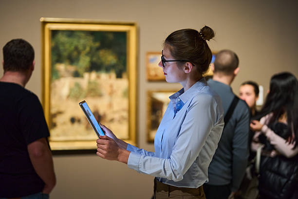 istock visitor in historical museum looking at art object 2205761409